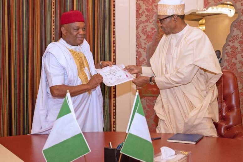 Orji Kalu presents election certificate to Buhari