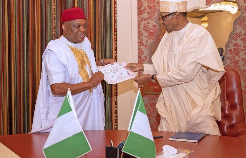 Orji Kalu presents election certificate to Buhari